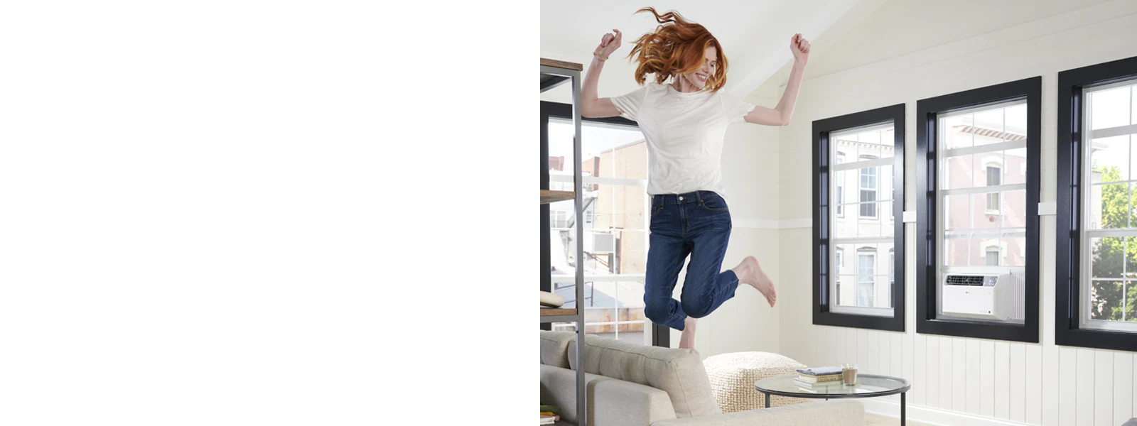 LG window air Conditioner in a living room and a woman jumping on a sofa