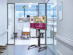 LG TV on the durable Peerless-AV Flat Panel Cart in a hospital