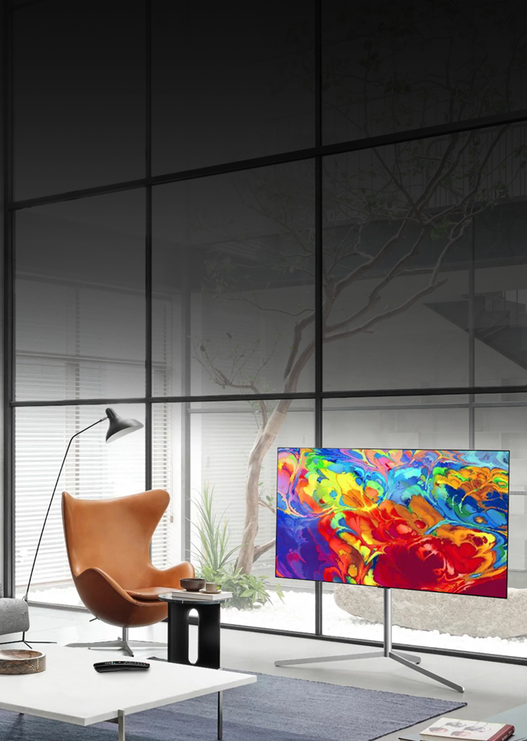 Office lobby with OLED TV next to chair and coffee table